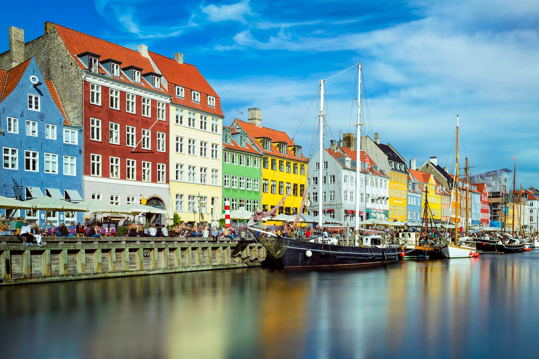 Colorful townhouses and tall ships along the Nyhavn canal in Copenhagen, Denmark